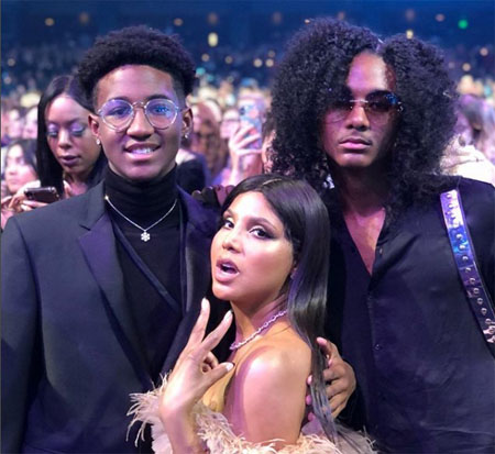 A photo of Denim with his mother and brother.